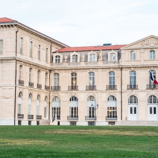 Close-up view of the Palais du Pharo in Marseille, showcasing the architectural details of the historic building and the surrounding lawns.